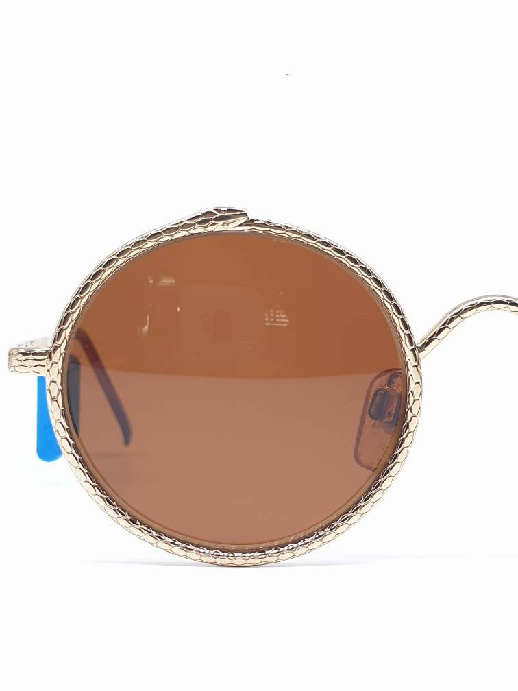 Oliver Valentino 1821 903 Esoteric golden snake round shape sunglasses, w/amazing carved snake. New and unworn conditions.