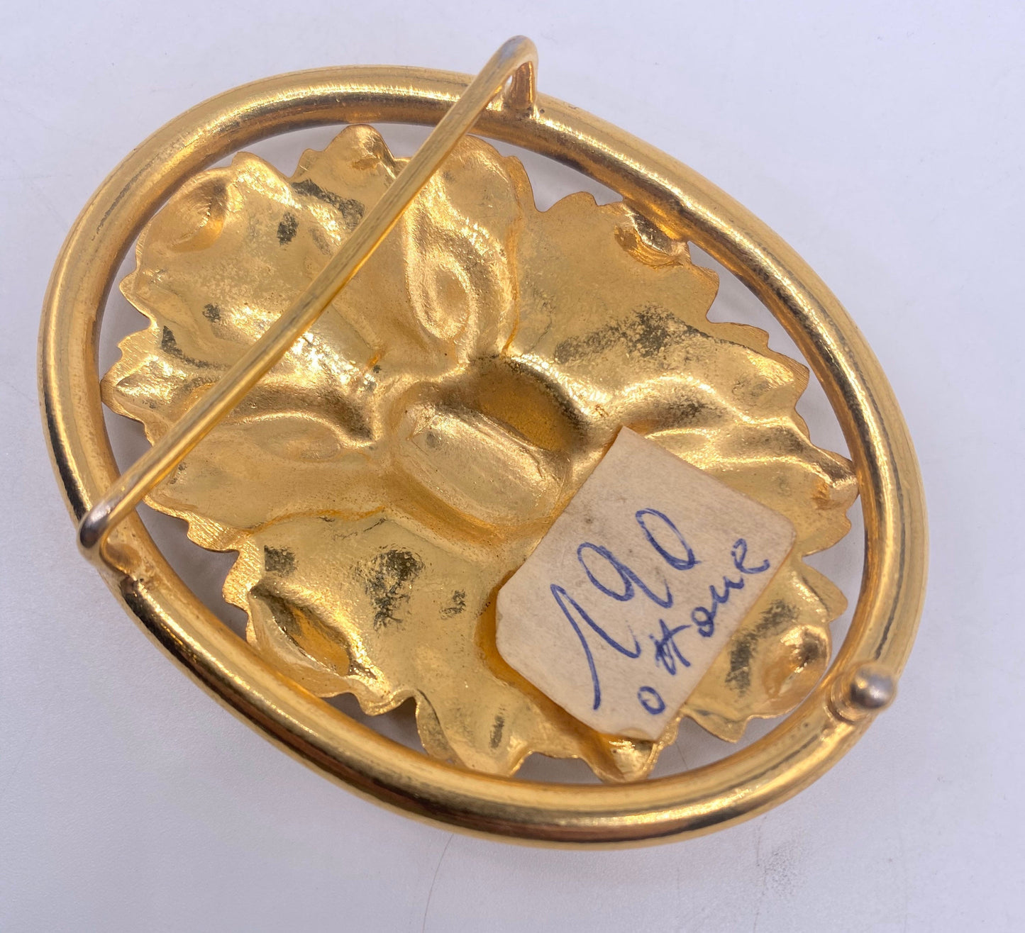 Baroque brass belt buckle with carved floral motif, NOs 70s