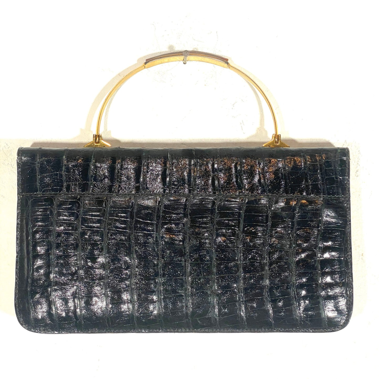 1970s black alligator clutch bag with brass / tortoise Bakelite handle, mint