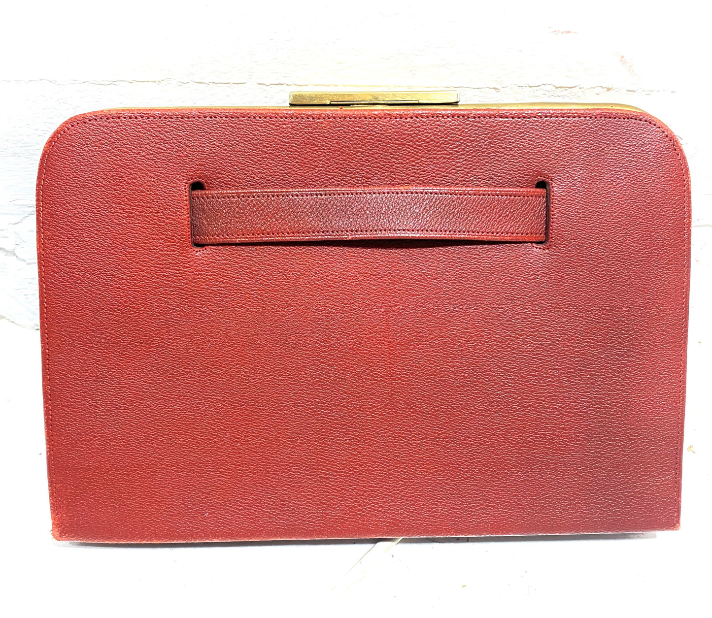 1960s burgundy leather and brass collectible clutch bag in mint condition