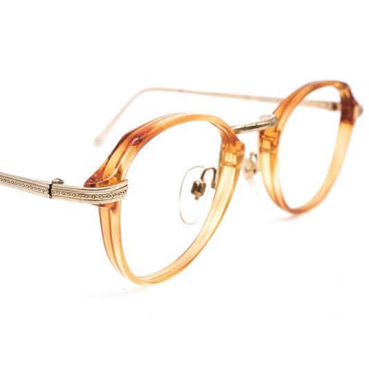 Safilo 1950s oval round cello semi amber eyeglasses frames with carved golden temples and nose bridge. Mint condition Made in Italy