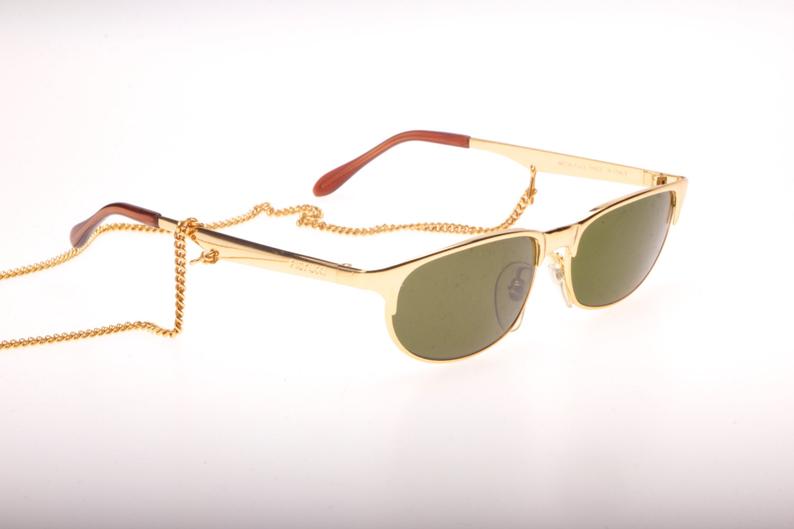 Fiorucci hip golden Cateye with pierced temples and enclosed chain, NOS 80s Italy