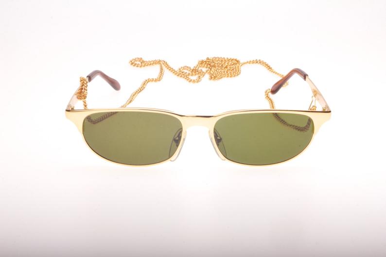 Fiorucci hip golden Cateye with pierced temples and enclosed chain, NOS 80s Italy